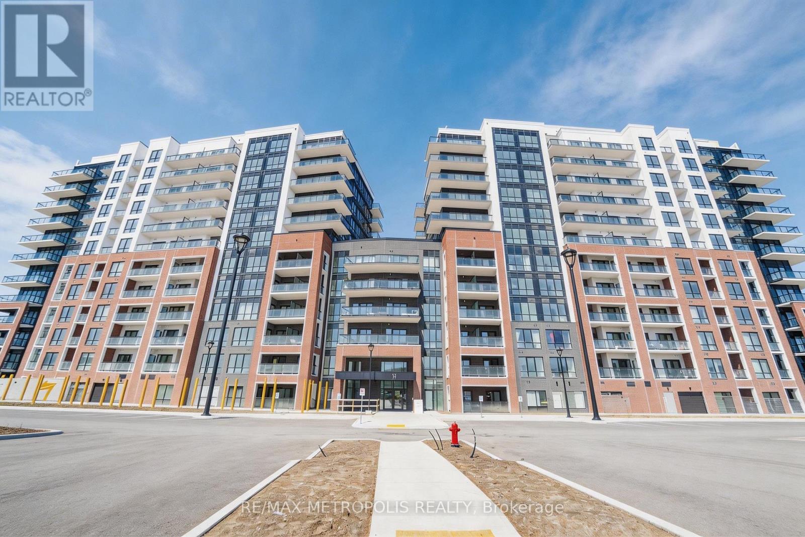 A large, modern apartment complex with multiple buildings and balconies.