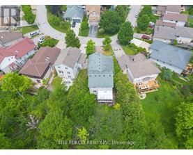 A bird's eye view of a residential area with houses and trees.