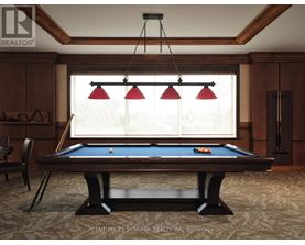 A pool table in a room with wooden walls and a window with blinds.