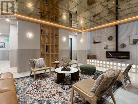 A modern living room with a glass ceiling and a rug on the floor.
