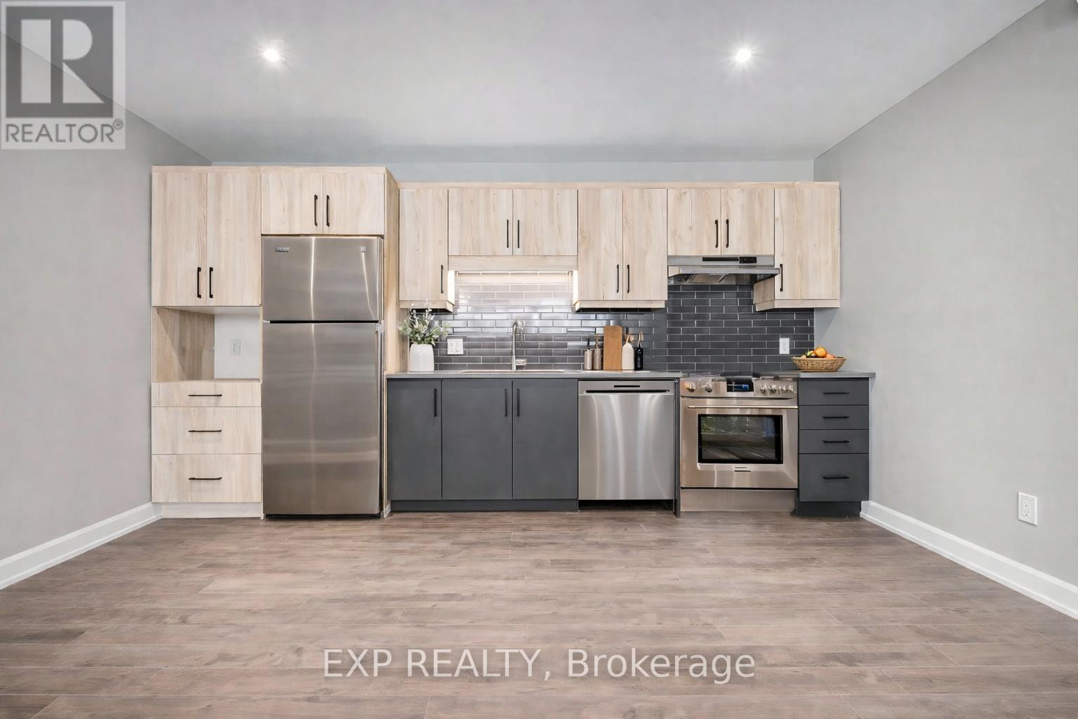 A kitchen with wooden cabinets and stainless steel appliances.