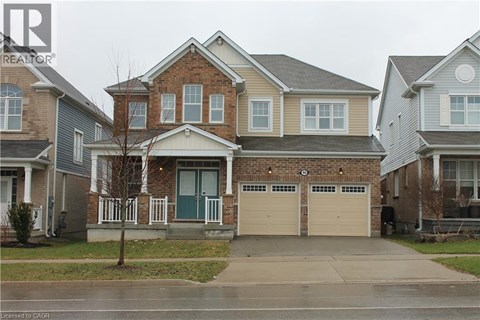 A house with a brick front and a garage.