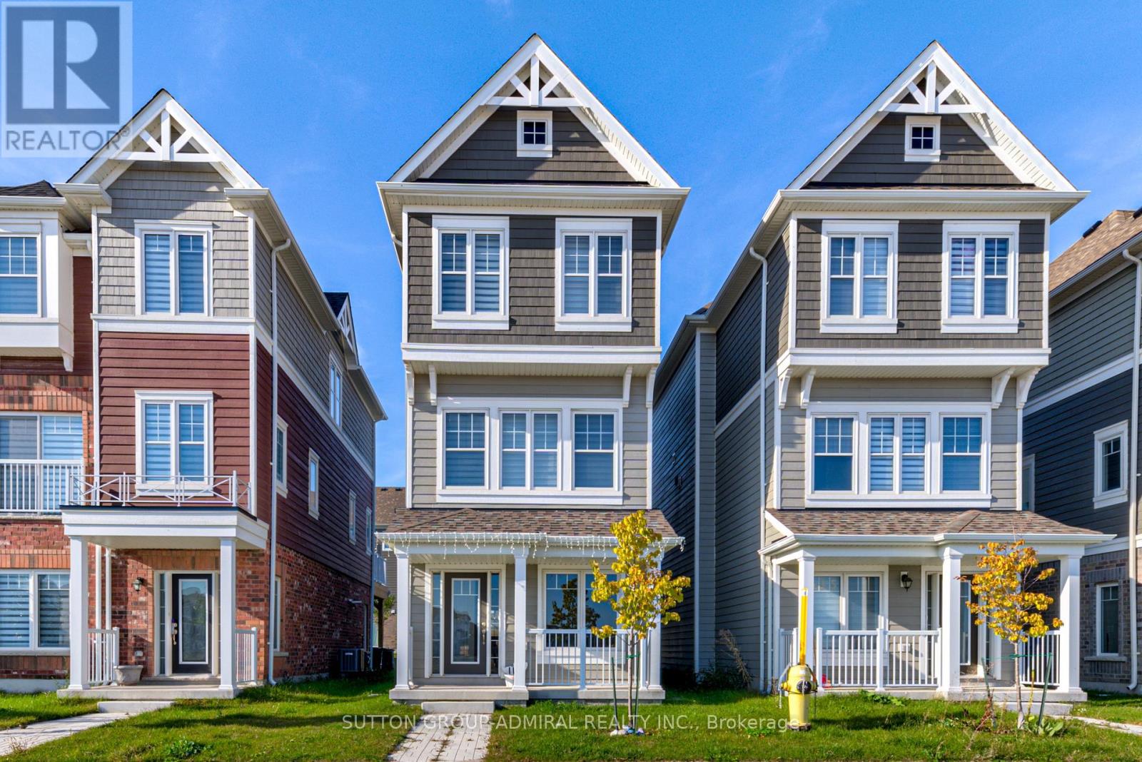 A row of houses with the brokerage logo in the bottom left corner.