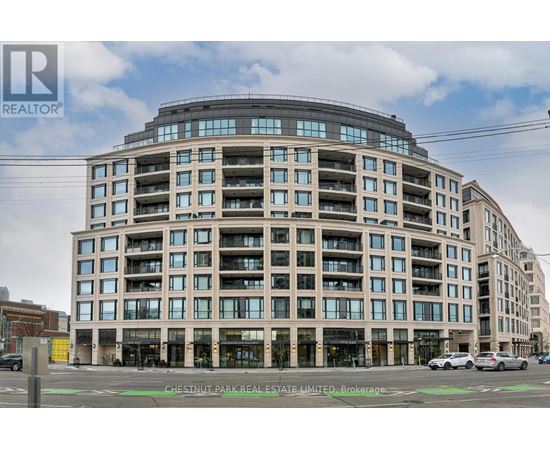 A large, modern building with many windows is the main focus of the image.