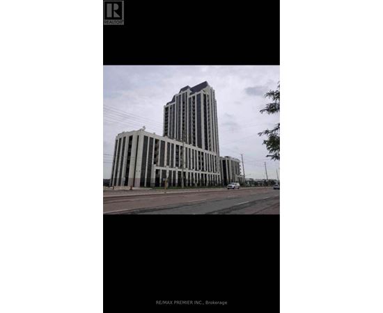 A tall building with a flat roof and a sign that reads RE/MAX PREMIER INC. Brokerage.