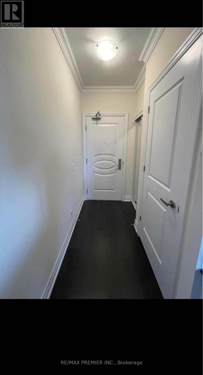 A hallway with a door at the end.