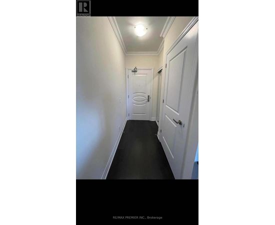 A hallway with a door at the end.