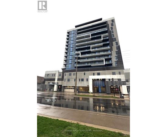 A tall building with balconies is under construction with a sign that says RE/MAX Realty Services Inc.