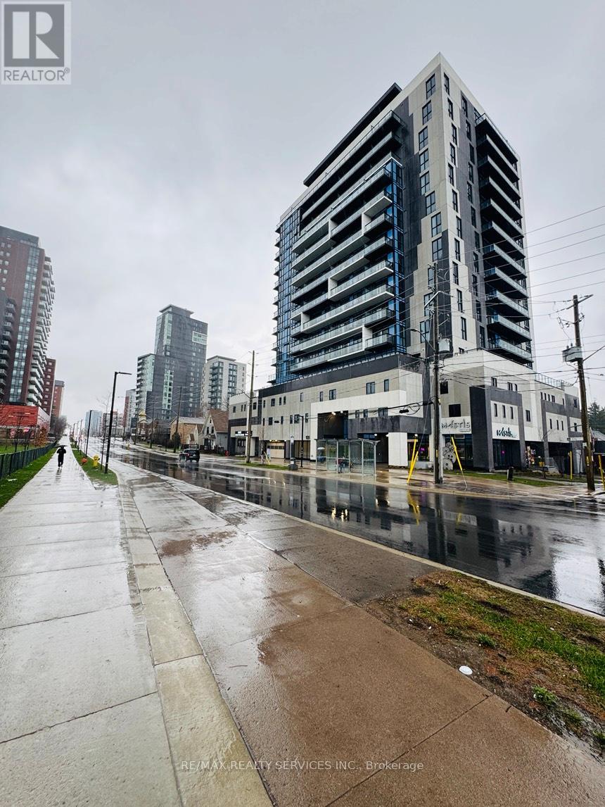 A tall building with a blue stripe on the side is in the background.