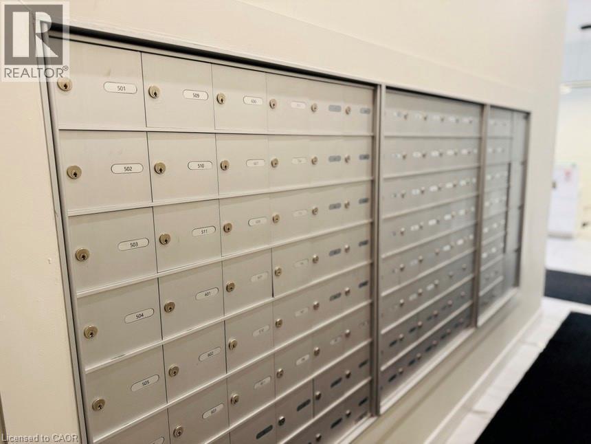 A row of metal mailboxes with numbers on them.