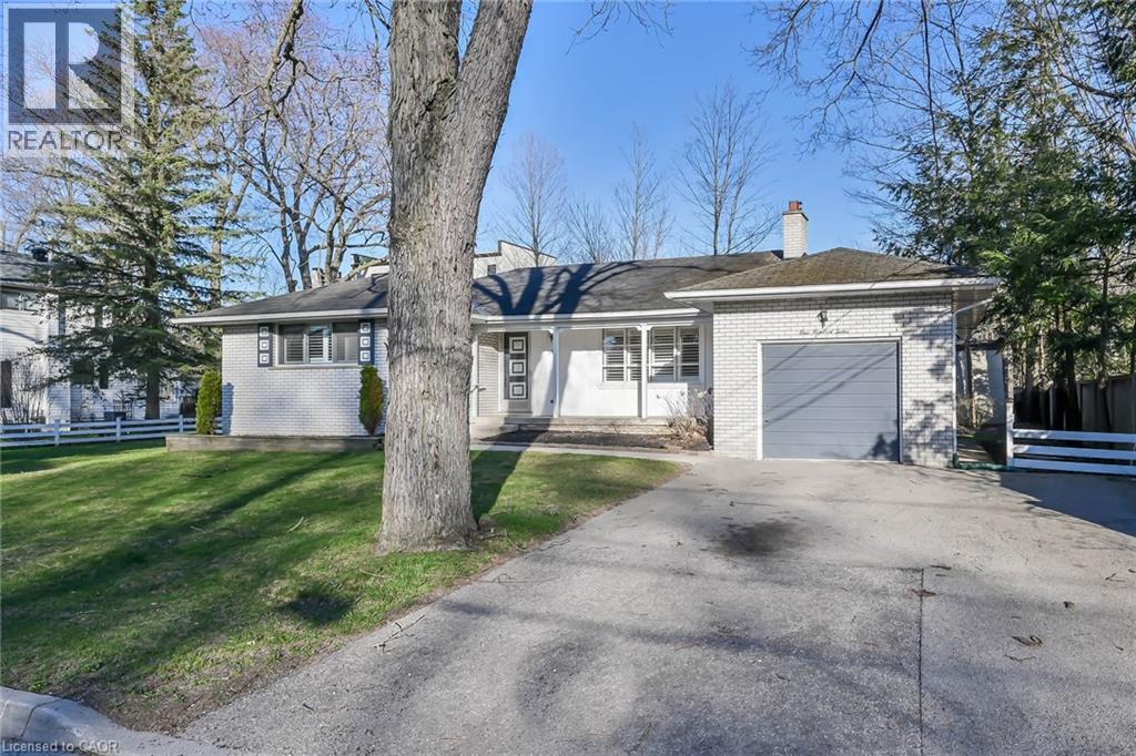 A house with a white garage door is for sale.
