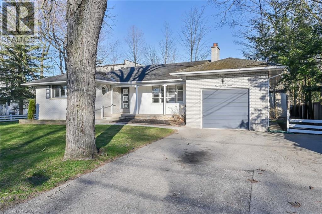 A house with a driveway in front of it.