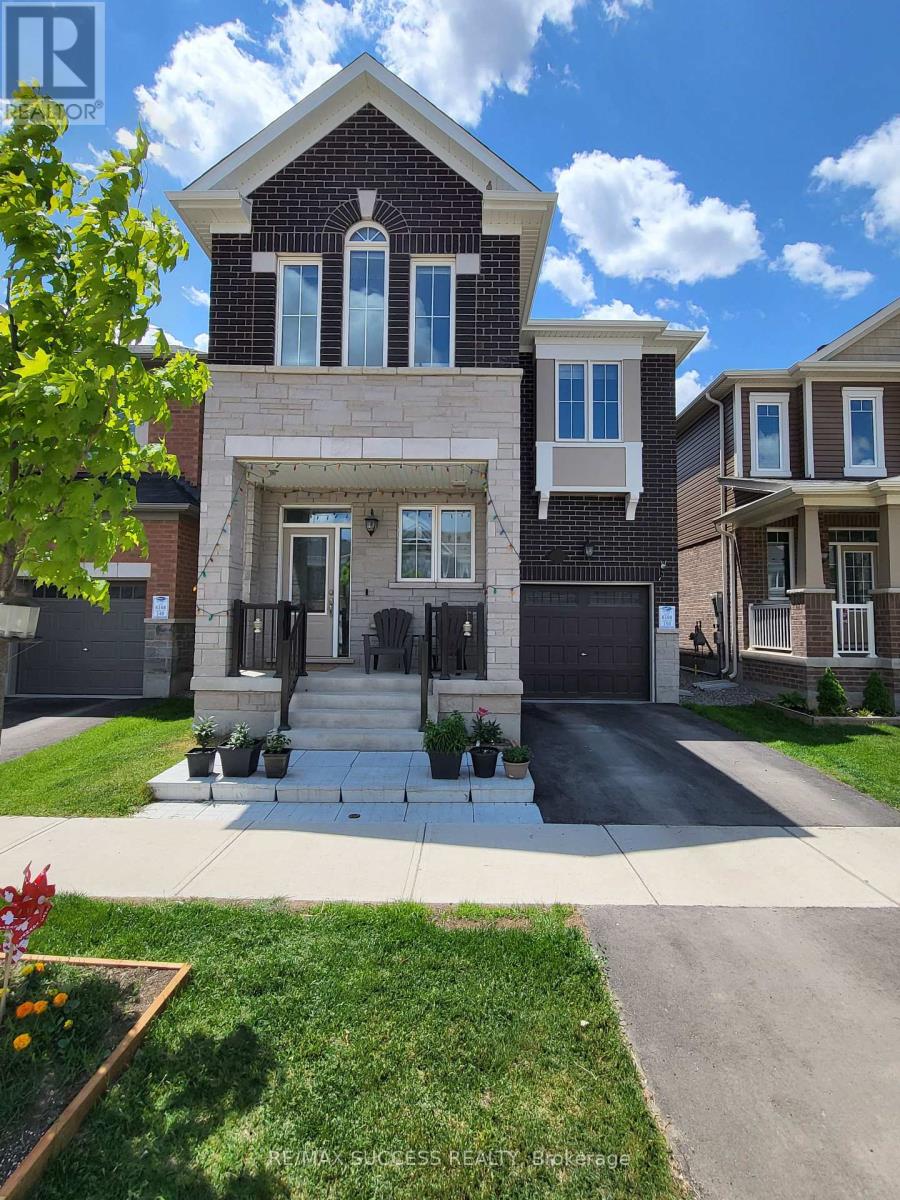 A house with a brick facade and a large front yard.