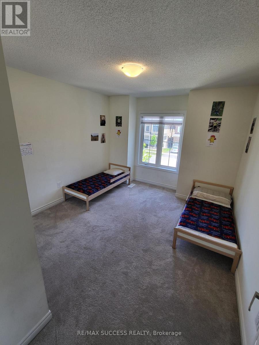 A bedroom with a bed and a bench in it.