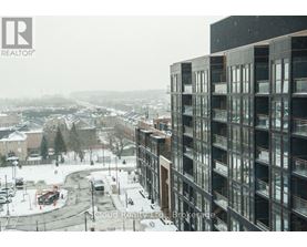 A view of a snowy landscape with a building on the right.