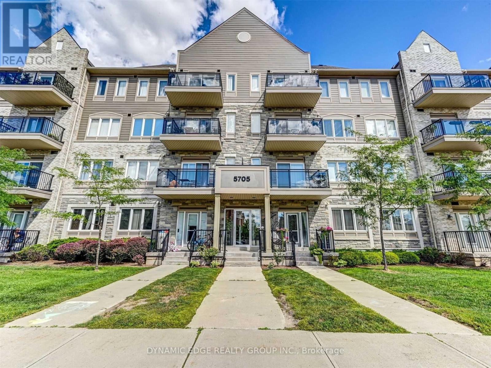 The image shows a multi-story building with the number 5705 on it.