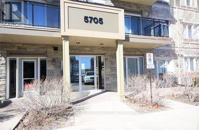 The image shows the front of a building with the number 5705 on it.