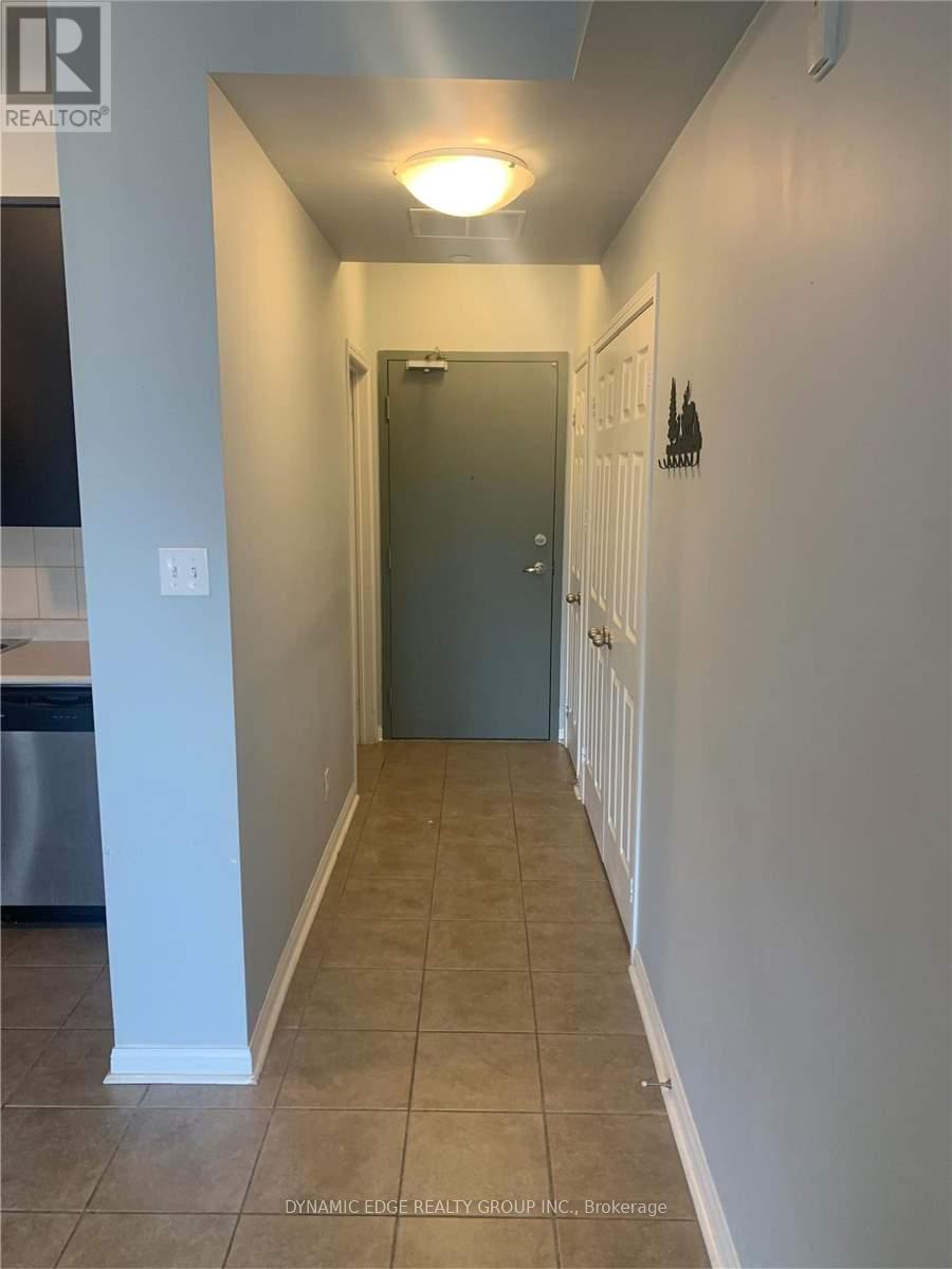 A hallway with a door at the end.