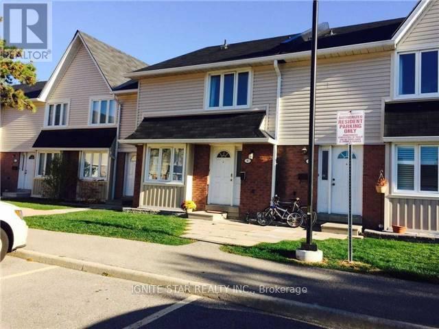 A house with a sign that says "ALL PARKING RIGHTS RESERVED" in front of it.