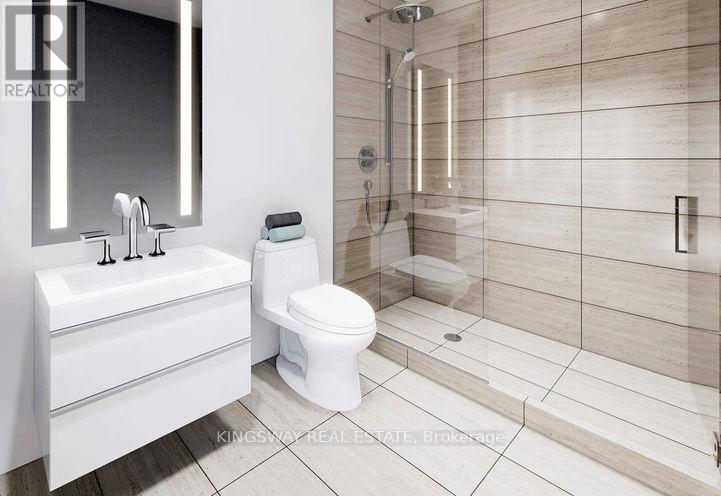 A white bathroom with a toilet, sink, and shower.
