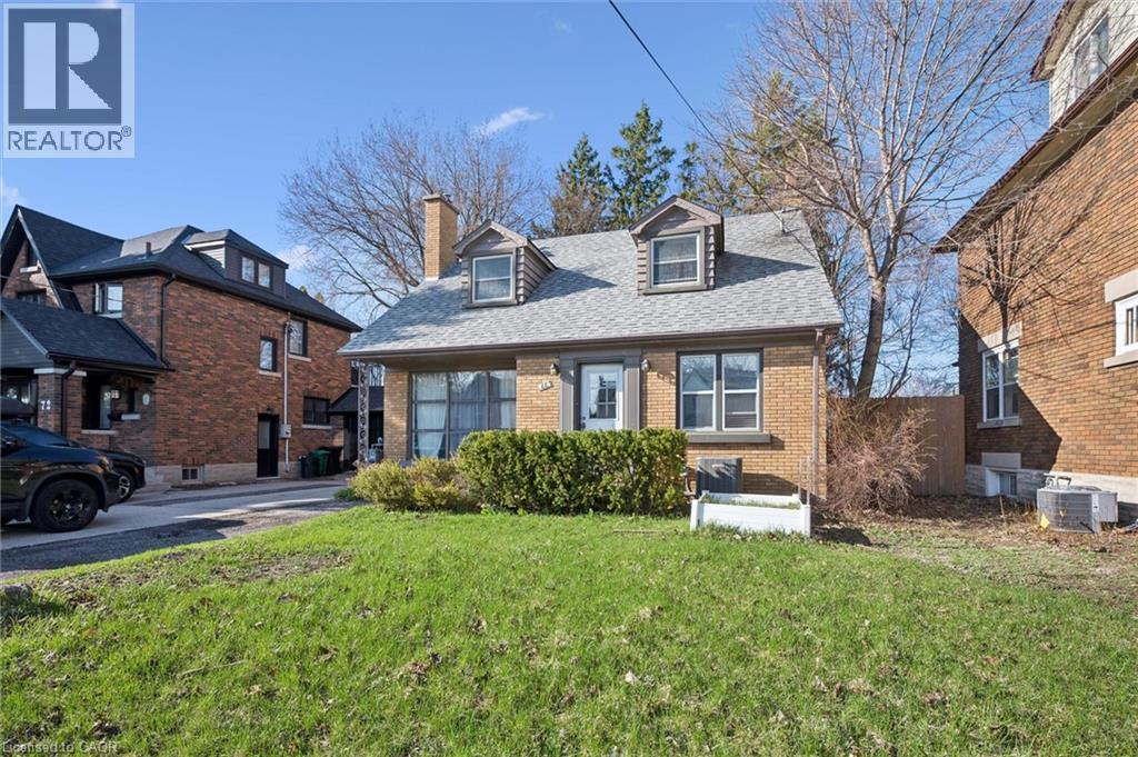 A house with a lawn in front of it.