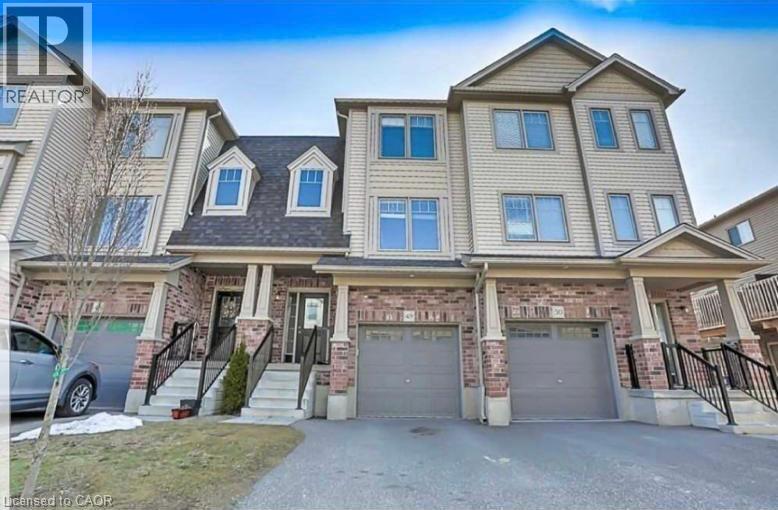 A large, two-story house with a garage is shown.