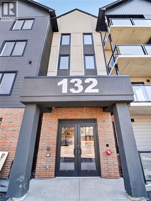 The entrance to a building with the number 132 on it.