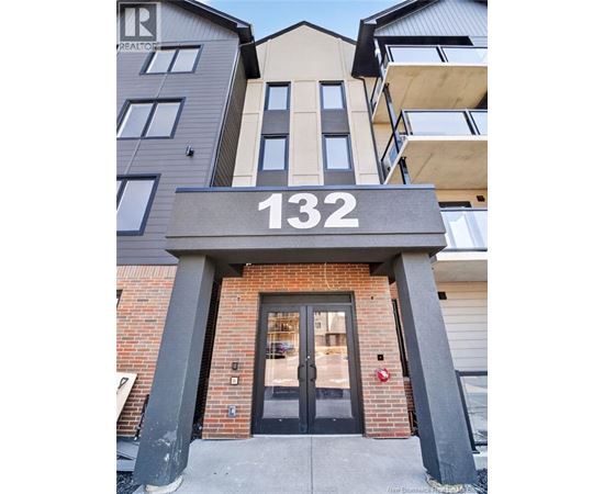 The entrance to a building with the number 132 on it.