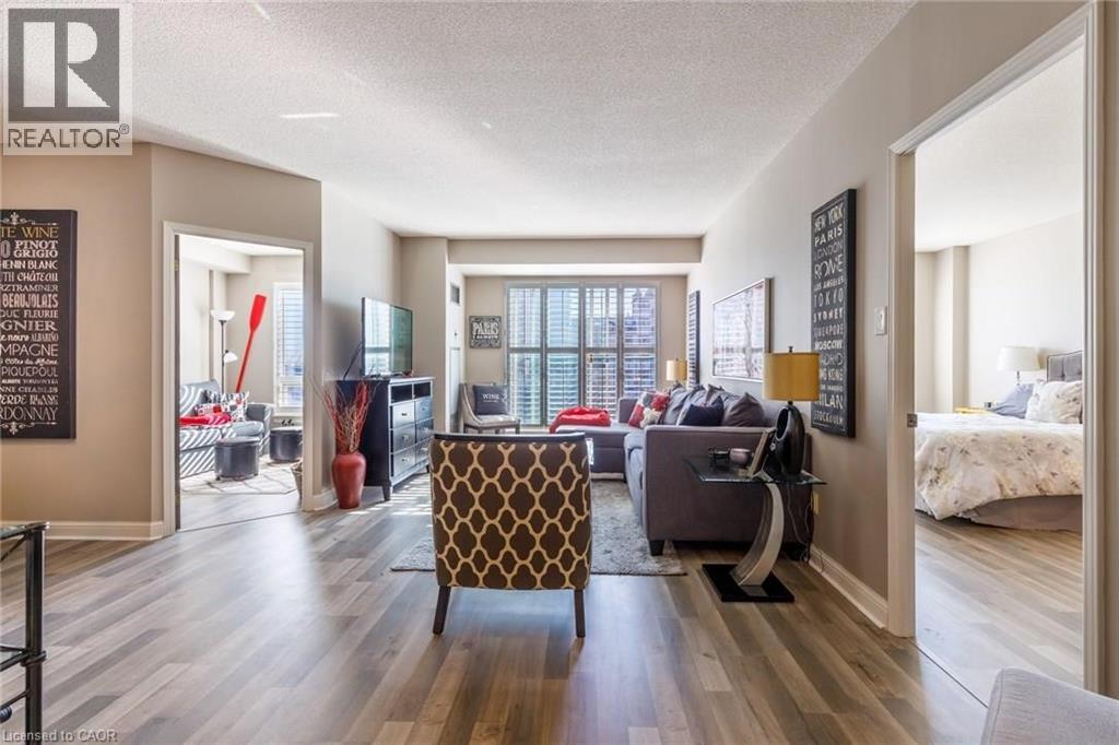 A living room with a brown patterned chair in the center.