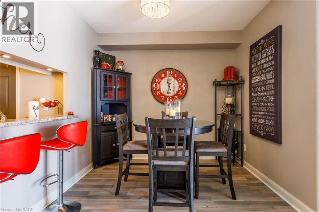A dining room with a table set for four.