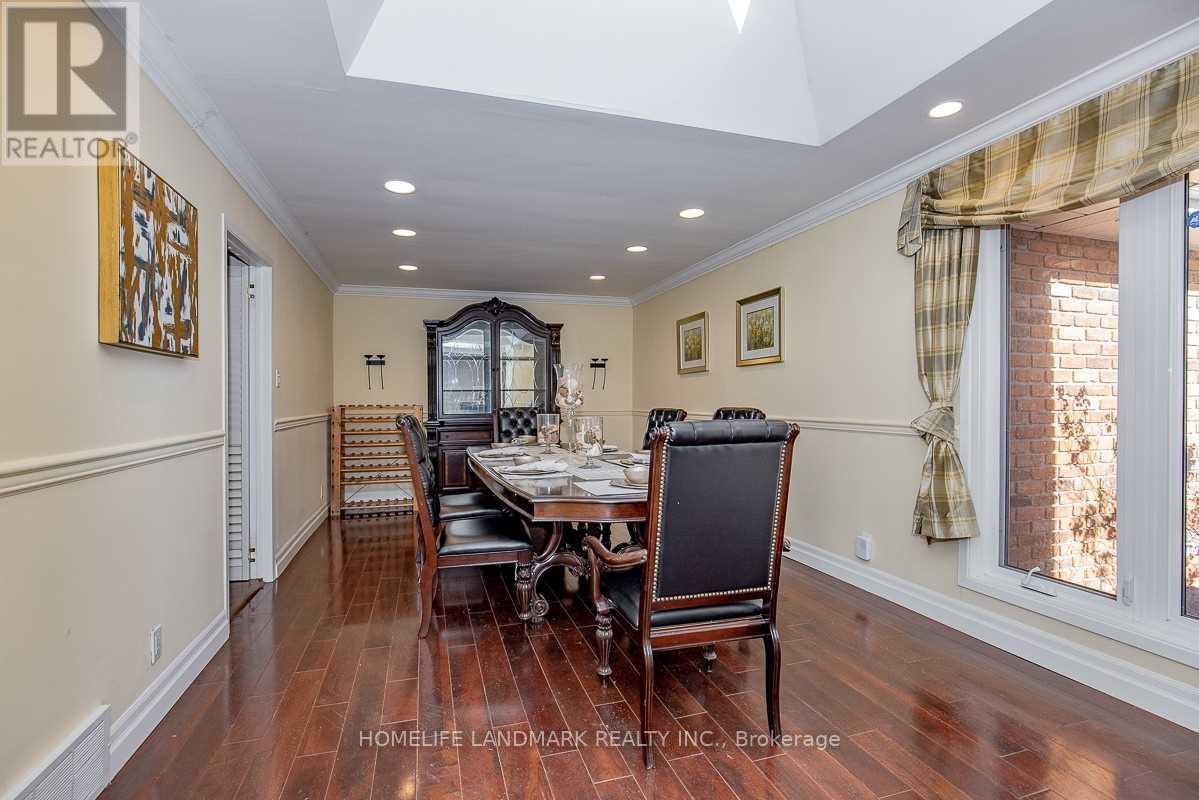A dining room with a table set for four.