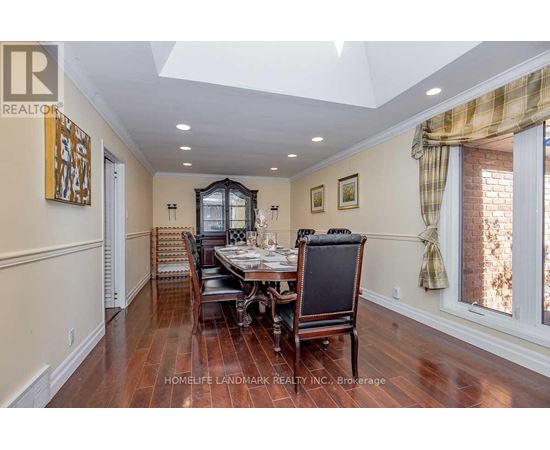 A dining room with a table set for four.