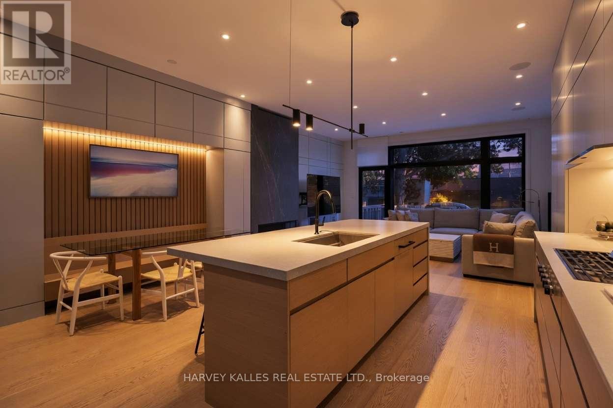 A modern kitchen with wooden cabinets and a large island.