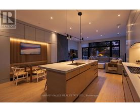 A modern kitchen with wooden cabinets and a large island.