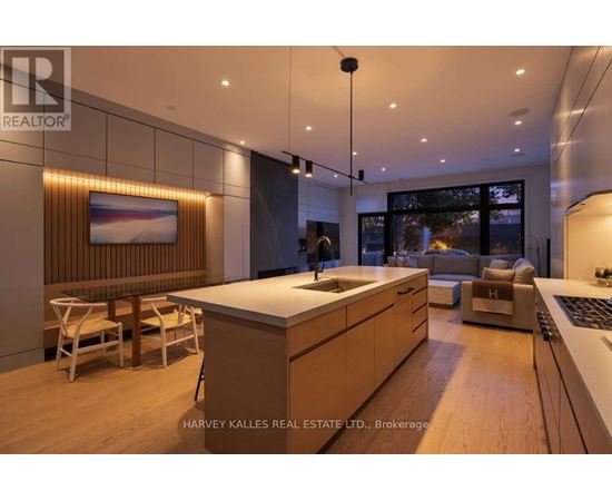 A modern kitchen with wooden cabinets and a large island.