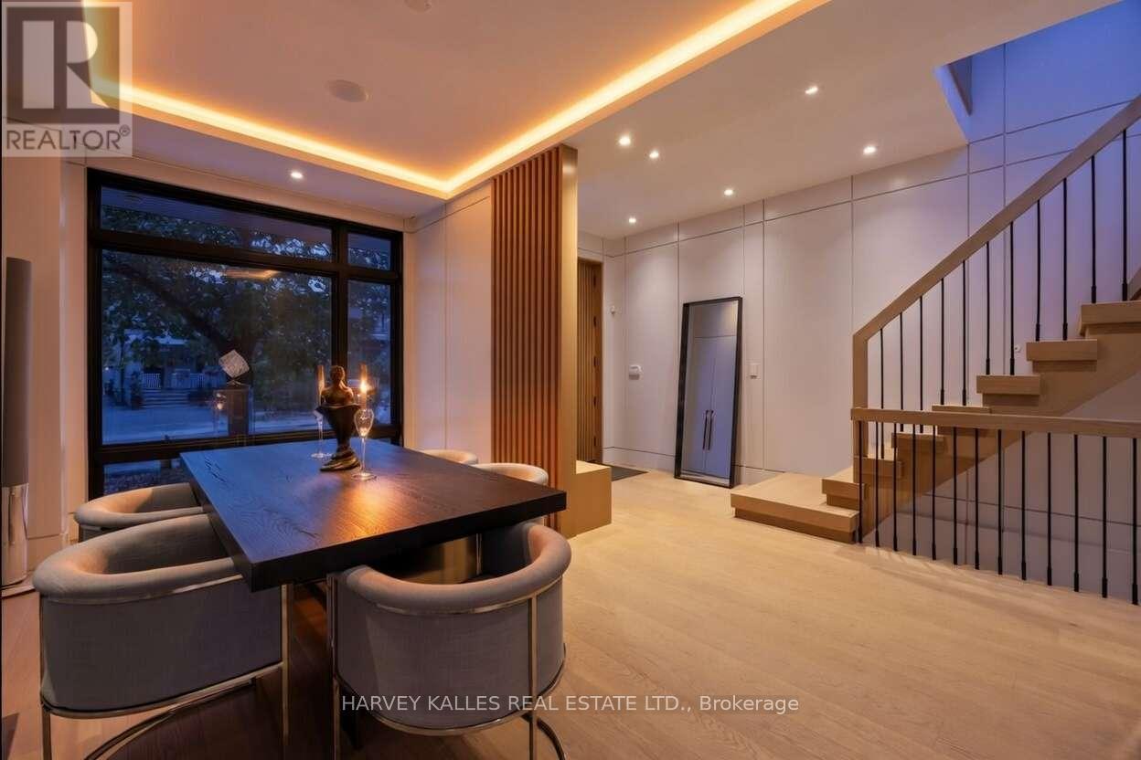 A dining area with a table and chairs is shown in the image.