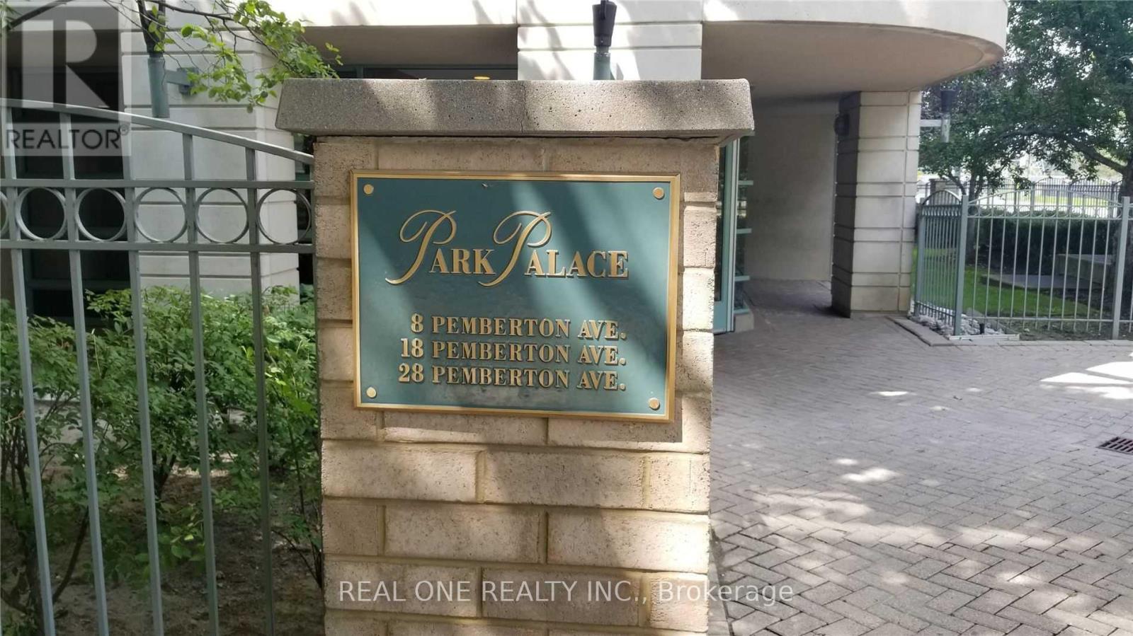 A sign for Park Place is in front of a building.