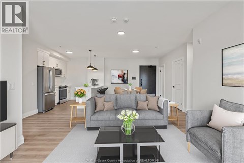 A modern living room with a grey couch and a coffee table.