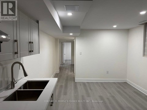A modern kitchen with a sink and cabinets.