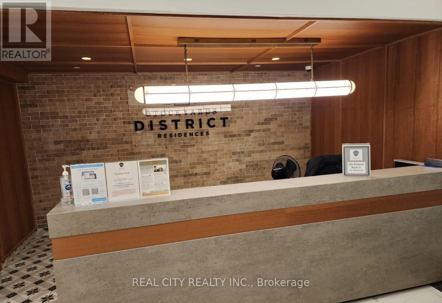 A reception desk with a sign that says "REALTOR" on it.