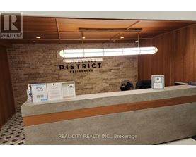 A reception desk with a sign that says "REALTOR" on it.