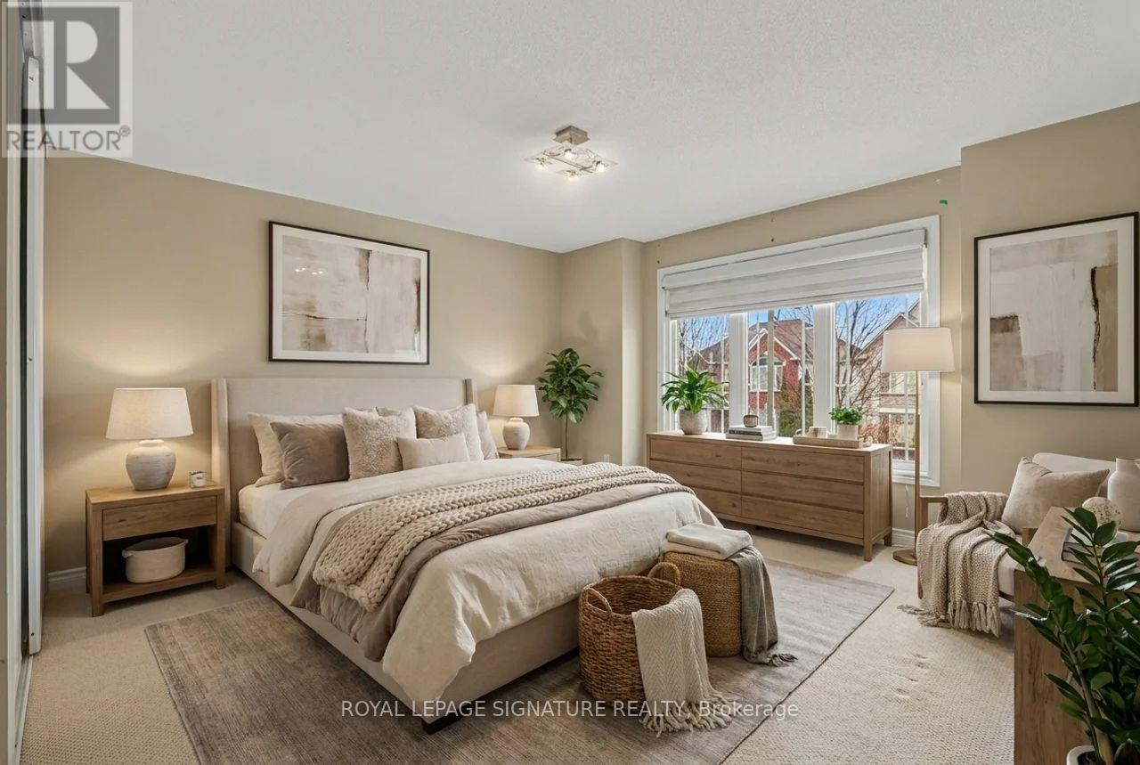 A bedroom with a large bed and a window overlooking a street.