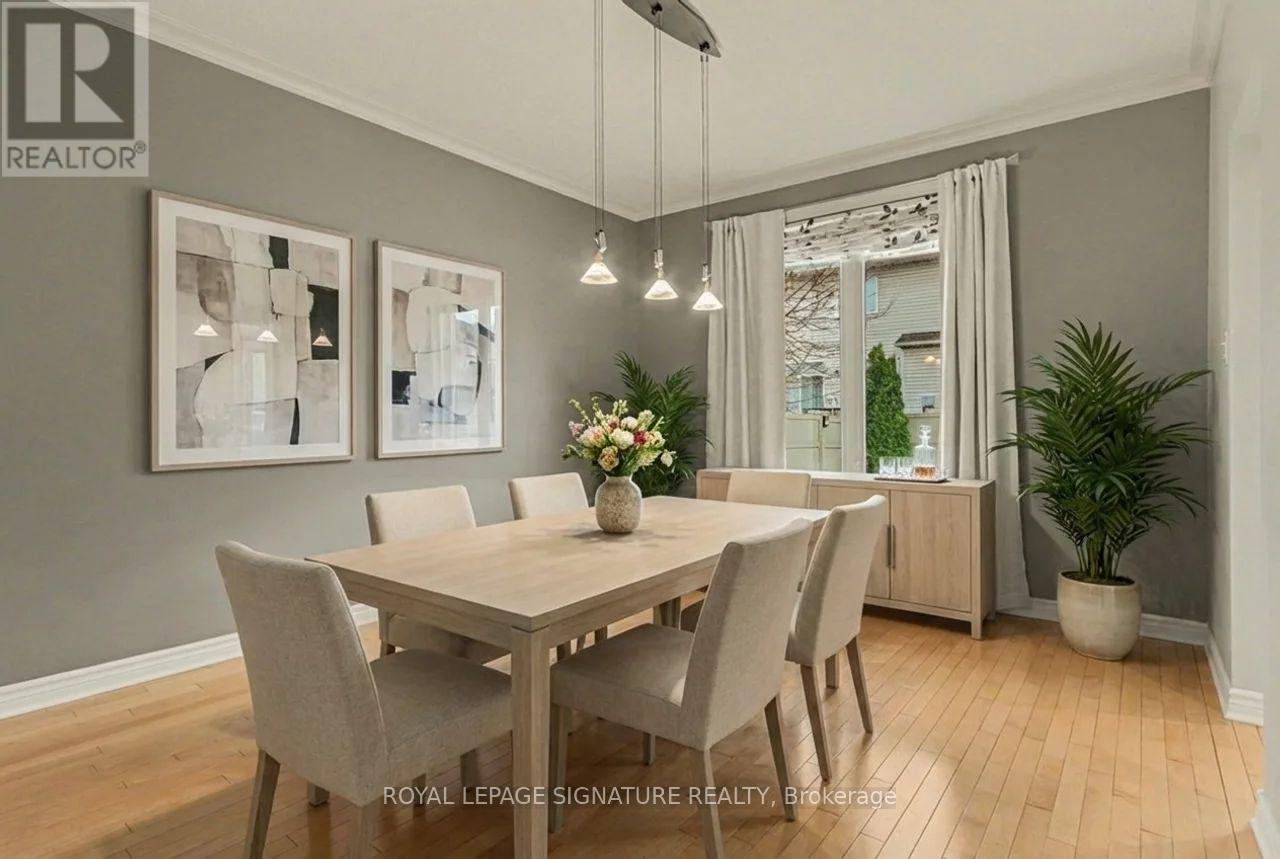 A dining room with a table set for four.