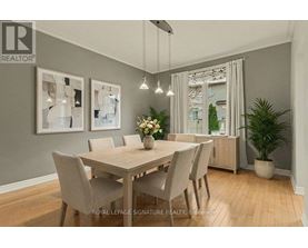 A dining room with a table set for four.