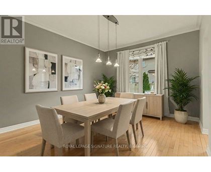 A dining room with a table set for four.