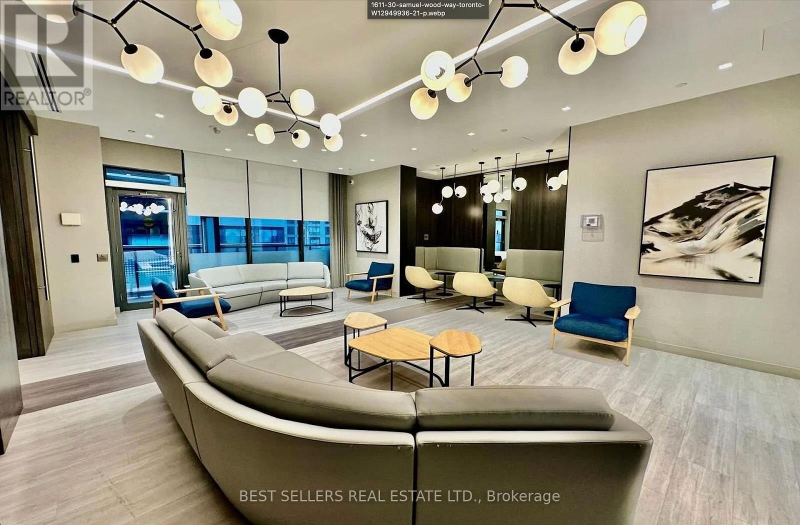 A modern living room with a large sofa and a coffee table.