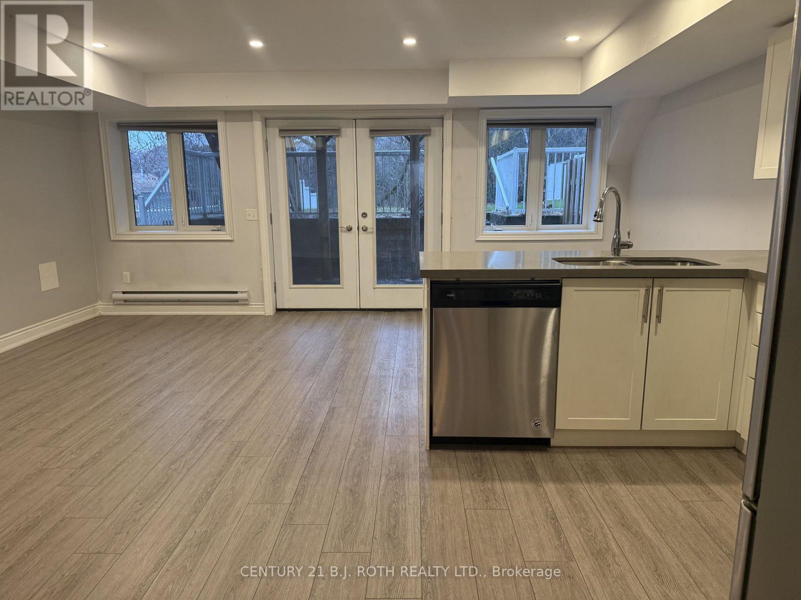 A kitchen with a dishwasher and cabinets.