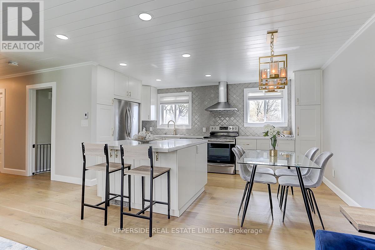 A modern kitchen with a dining table set up.