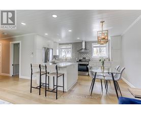 A modern kitchen with a dining table set up.