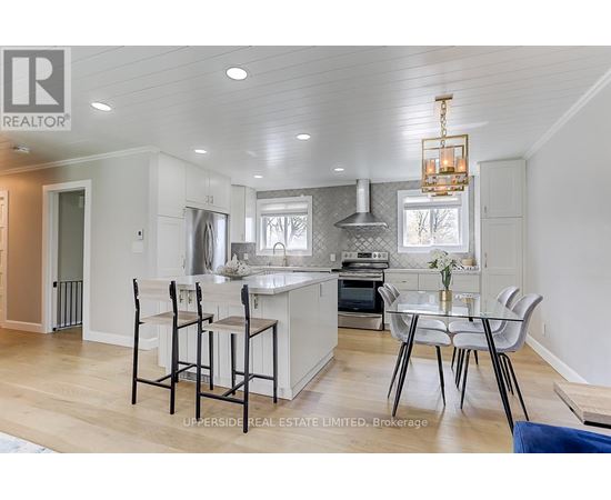 A modern kitchen with a dining table set up.